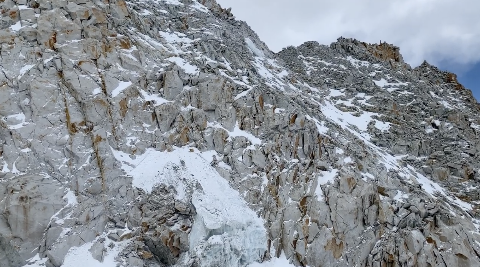 sherpani-col-rappel-down-look-back.png